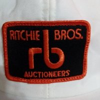 Шапка с козирка-ritchie bros auctions.Нова!, снимка 5 - Шапки - 21492532