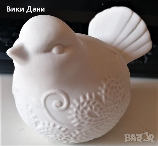 скулптура птичка с релеф