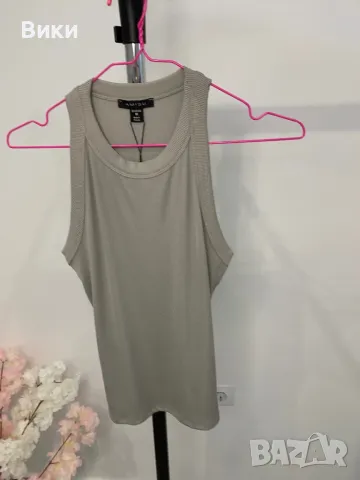 Потник в размер М, нов с етикет би бил подходящ и за S