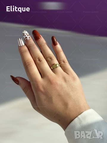 Златист дамски пръстен от медицинска стомана с изискана декорация звезда и блестящи камъни