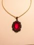 Прелестно колие и медальон с рубинено червен кабошон в цвят антично Злато., снимка 1 - Колиета, медальони, синджири - 27637673