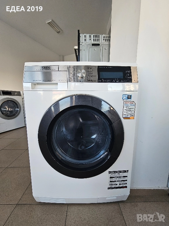 Комбинирана пералня със сушилня с термопомпа AEG , снимка 1