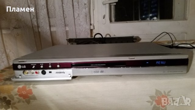 DVD+HDD LG RH7000, снимка 1 - Плейъри, домашно кино, прожектори - 43658385