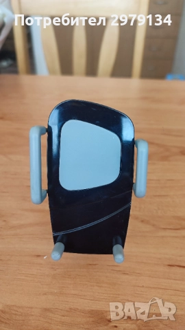 Държач за телефон с разширяващи се държачи.