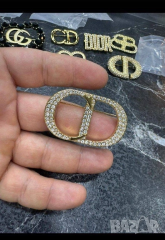 брошки christian dior ysl saint laurent 