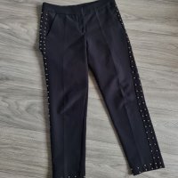 Уникален дамски чер панталон с капси, снимка 1 - Панталони - 37321481