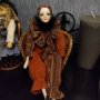 Порцеланова кукла ръчна изработка с ратаново канапе , снимка 1 - Колекции - 38015727