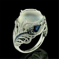 Дамски пръстен със сребърно покритие S925 - млечно бял камък и сини кристали, снимка 1 - Пръстени - 27525342