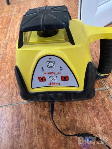 Лазерен нивел LEICA RUGBY 100. Пълен комплект зарядно и лазерна рулетка, снимка 3 - Измервателни инструменти - 51664288