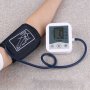Цифров апарат за измерване на кръвно налягане и пулс над лакатя., снимка 1