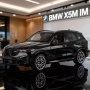 BMW X5M iM SUV 2025 - мащаб 1:18 на PAUDI моделът е нов в кутия, снимка 1
