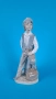 Порцеланова фигурка на момче - обущар, снимка 1