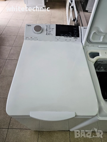 Пералня с горно зареждане AEG LTX6G271E, снимка 3 - Перални - 52533361