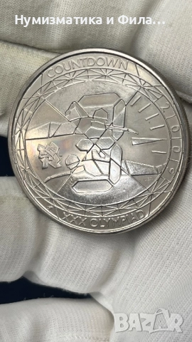 Монета 5 паунда  2009 Плуване