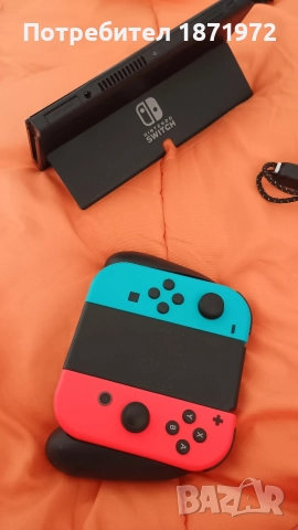Продавам Nintendo Switch OLED ,пълен комплект + 2 оригинални игри, снимка 5 - Nintendo конзоли - 52863054