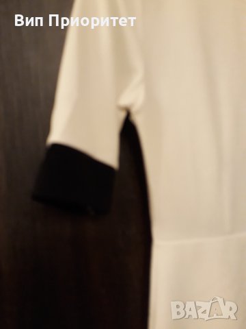 Бяла рокля , интересен модел,гарнирана с черни сегменти и черен дълъг цип на гърба,еластична материя, снимка 3 - Рокли - 37434606