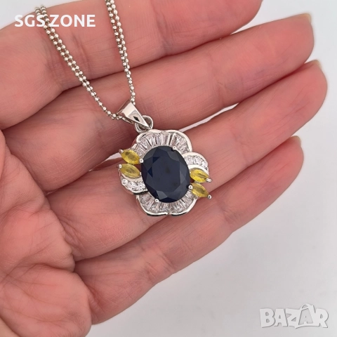 СРЕБЪРЕН ВИСУЛКА С ЦЕНТРАЛЕН СИН САПФИР И ЖЪЛТИ САПФИРИ