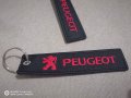 Текстилен ключодържател с бродиран червен надпис и емблема на Пежо Peugeot кола автомобил джип ван б, снимка 1 - Аксесоари и консумативи - 34592522
