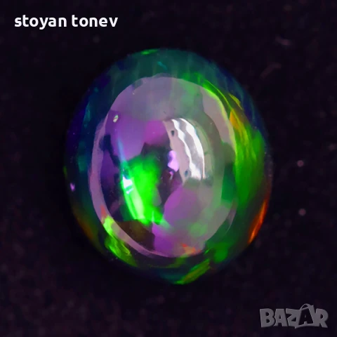 Голям черен опал с изумяваща игра на цветове тип дъга 6.59кт! Нов!