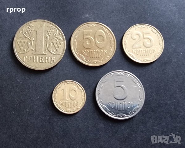 Монети. Украйна. 1 гривна и  5, 10,  25, 50 украински копийки. 