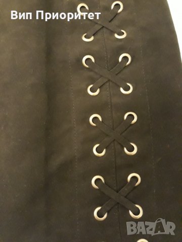 Къса пола черна Н&М с капси и кръстосани връзки, изпечена материя , с цип на гърба, снимка 4 - Поли - 37414559