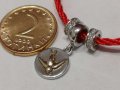 Дамски гердан на червен шнур със сребърен медальон с лястовица
