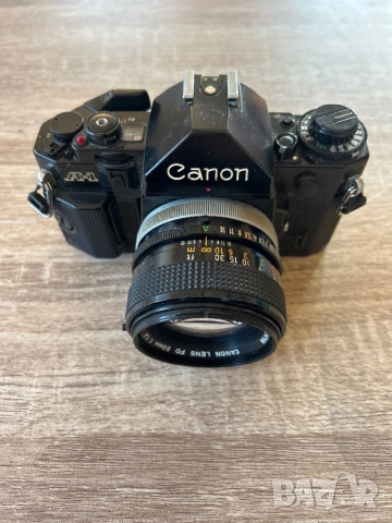 Canon A-1 с обектив Canon lens fd 50mm 1:1,4 S.S.C, снимка 2 - Фотоапарати - 52062393