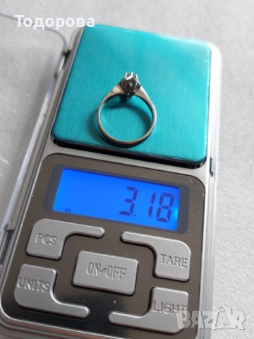 Дамски златен пръстен с инкрустиран диамант 0.20 карата,бяло злато проба 750, снимка 7 - Пръстени - 52592247