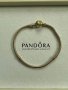 Красива Пандора гривна с класическа закопчалка в голд цвят, снимка 1 - Гривни - 38384757