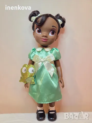 Кукла Тиана (Принцесата и жабокът)
42см.
Оригинална кукла на Дисни 
55лв.
, снимка 2 - Кукли - 50425771