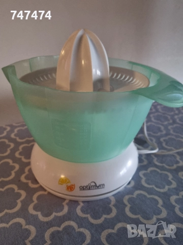 Електрическа цитрус преса Optimum.