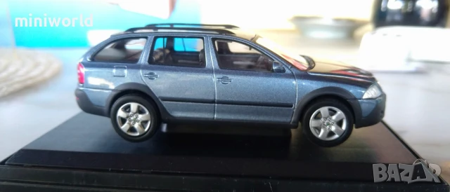Skoda Octavia Combi Scout - мащаб 1:43 на Abrex моделът е нов в PVC дисплей-кейс, снимка 6 - Колекции - 50659735