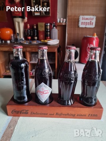 Комплект Coca Cola, 4 различни бутилки върху дървена дъска., снимка 1 - Колекции - 43368310