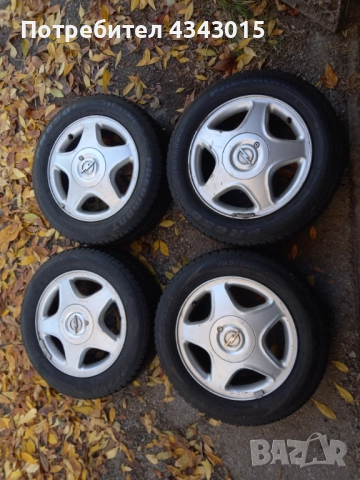 4 броя гуми с гуми , снимка 2 - Гуми и джанти - 52110642