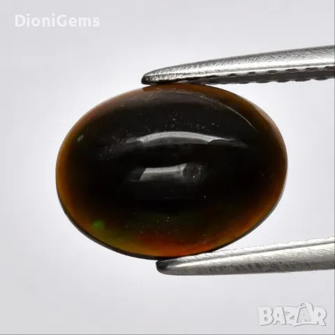 ✨ 1.39-каратов Натурален Черен Опал – Овален Кабошон, Етиопия | Флорални Дъгови Отблясъци ✨, снимка 1