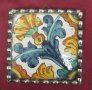 17c Antique Spanish Mayolica tile with stylised carnation