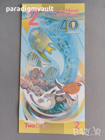 Банкнота - Източни Кариби - 2 долара (юбилейна) UNC | 2023г., снимка 3 - Нумизматика и бонистика - 52226673
