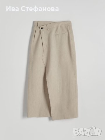 Пола бежова асиметричен акцент  със свободна кройка от елегантна материя с деликатен меланжов десен., снимка 3 - Поли - 44132936