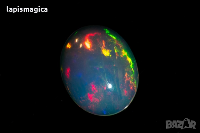 Етиопски опал 0.82ct 9x7mm овален кабошон, снимка 4 - Други - 52135226