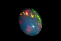 Етиопски опал 0.82ct 9x7mm овален кабошон, снимка 4