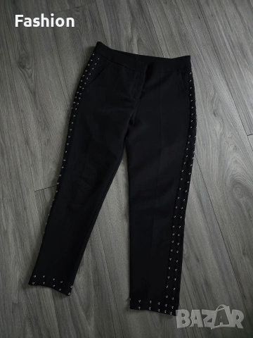 Жесток чер дамски панталон с капси.
