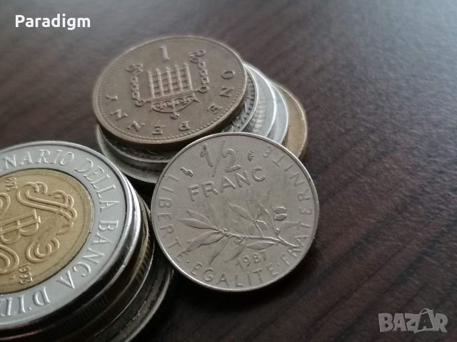 Монета - Франция - 1/2 (половин) франк | 1987г.