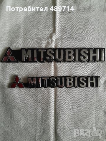 Две емблеми MITSUBISHI
