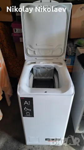 Пералня AEG с горно пълнене