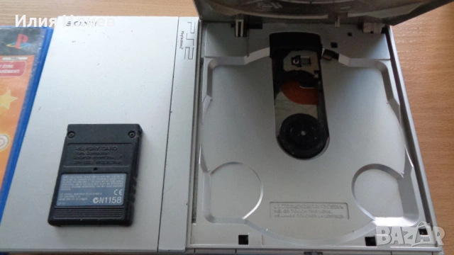 Sony PlayStation 2 Slim Silver Edition с чип ModBo + Gran Turismo 4 + Sega Superstars, снимка 2 - PlayStation конзоли - 53402771