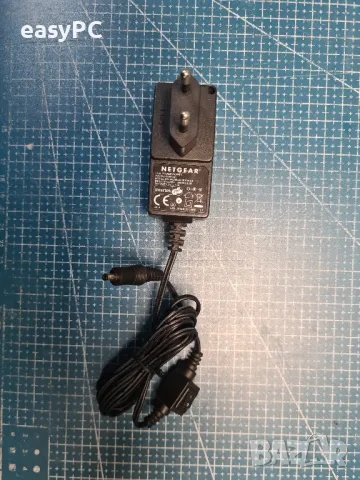 Оригинален захранващ адаптер Netgear 332-10309-01 MU08A9075100-C5 7,5V 1A, снимка 4 - Суичове - 47854117